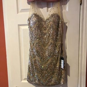 Jeweled nude cocktail dress.